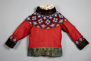 Image of Child's jacket with seal trim, beaded collar, and quilted lining